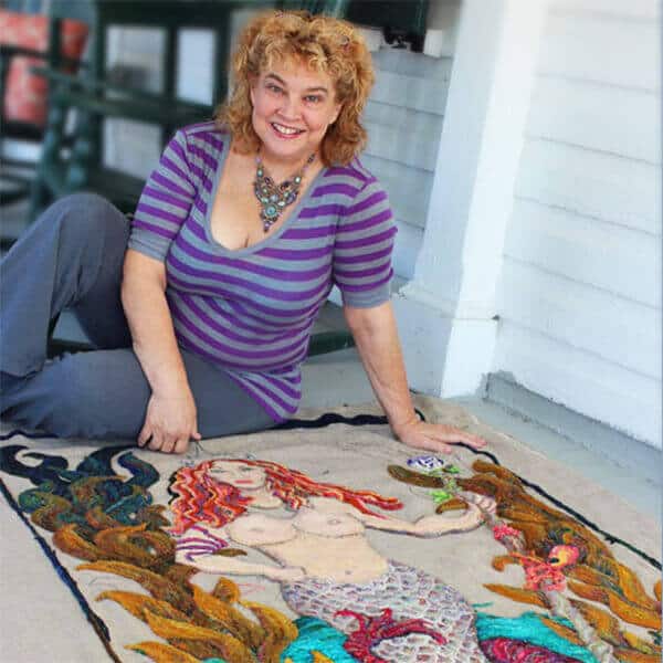 Michele Micarelli teaching a rug hooking workshop